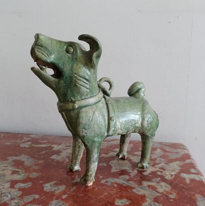 null Green glazed terracotta Han style Fô Dog. H.32 cm (accidents).
Certificate by...