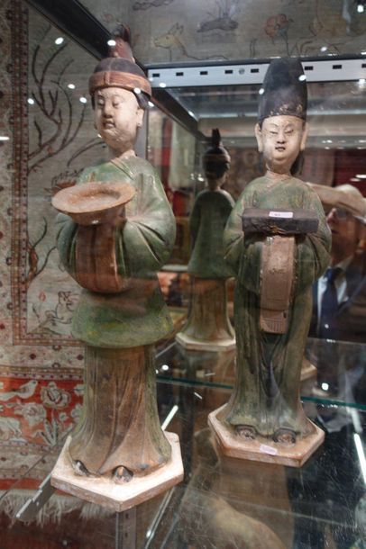 null Pair of green glazed terracotta offering bearers.

China, Ming style. H. 45...