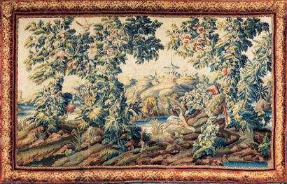 AUBUSSON Tapisserie à décor de volatiles dans un paysage lacustre, au loin se détachent...