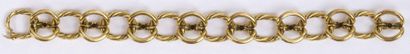 null BRACELET yellow gold chain with oval gadrooned links and alternating double...