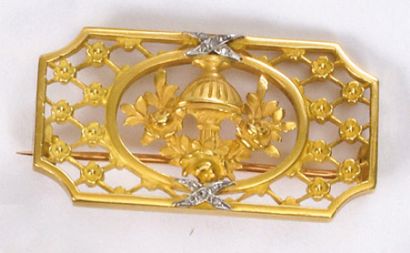 null Small PIN PLATE in openwork yellow gold with decoration of a vase decorated...
