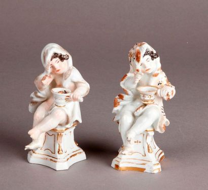 MEISSEN Two porcelain statuettes depicting winter in the guise of a young boy sitting...