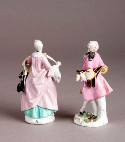 MEISSEN Two porcelain statuettes depicting a gentleman and a fine woman holding a...