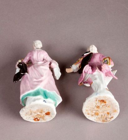 MEISSEN Two porcelain statuettes depicting a gentleman and a fine woman holding a...