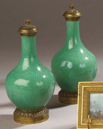 null PAIR OF SMALL BOTTLES made of porcelain and monochrome enamel cracked apple...