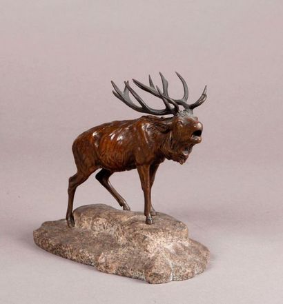 null Small bronze SUBJECT with brown patina representing a deer braying, placed on...