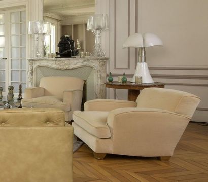 TRAVAIL FRANÇAIS Important three-seater sofa with wavy backrest and a suite of three...