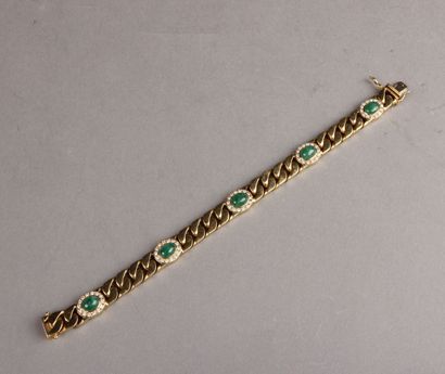 null BRACELET in yellow gold, set with five small oval cabochon emeralds in a circle...