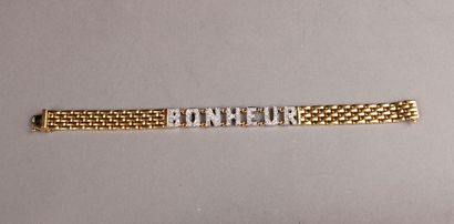 null BRACELET in yellow gold, grain of rice link, in the centre a lettered link paved...