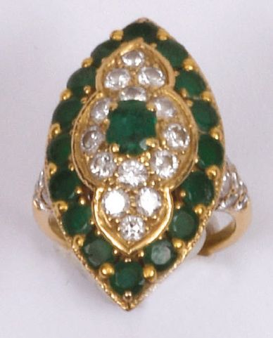 MAUBOUSSIN - Marquise ring set with an oval emerald in the center of a polylobate...