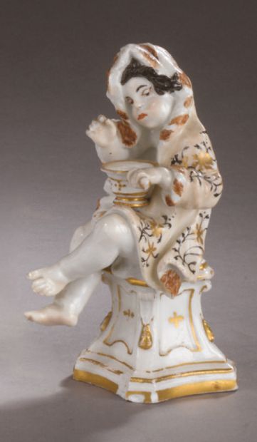 MEISSEN Two porcelain statuettes representing winter as a young boy sitting on a...