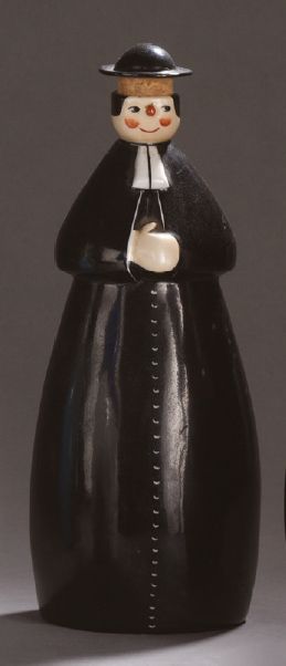 ROBJ 
Anthropomorphic liquor bottle representing a priest in black glazed ceramic....