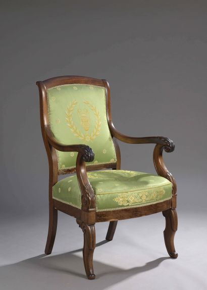 null TWO mahogany veneered armrests with gadroons and dolphins, standing on arched...