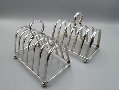 null PAIR OF TOASTS RACKS with 6 trapezoidal arched supports and silver plated ball...