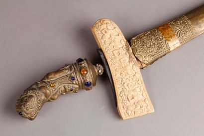 null Important KRISS. Handle made of brass and coloured stones decorated with divinity....