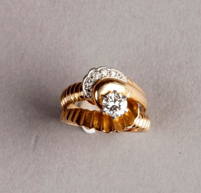 null Yellow gold tourbillon ring, set with a small brilliant-cut diamond of about...