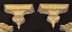 null - PAIRE D'APPLIQUES en bois sculpté et doré. En partie d'époque Louis XIV. H....