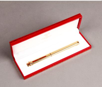 CARTIER. Trinity roller pen in gold-plated...