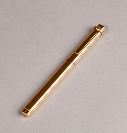 null CARTIER. Trinity roller pen in gold-plated metal with stripes decoration, numbered...