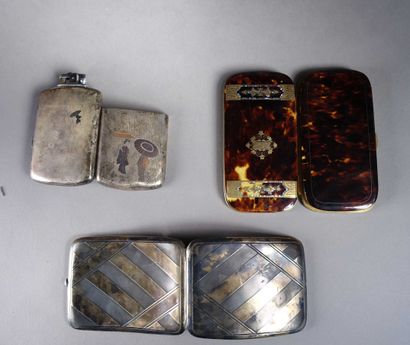 null Two silver cigarette cases, one forming a lighter with Japanese decoration.

Joint:...