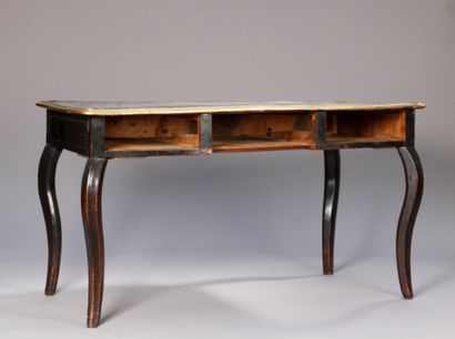 null Small flat desk in blackened wood, opening to three drawers in belt, posing...