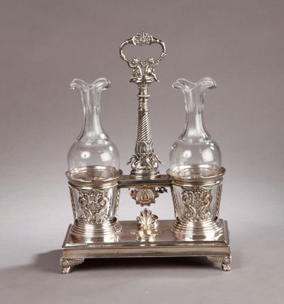 null SILVER OILER-VINEGARIAN, fluted shaft surmounted by two loves, decorated with...
