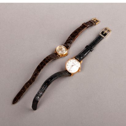 null Two ladies' BRACELETS WATCHES, circular gold cases, worn leather straps.
RELIDE...