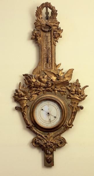 null Baromètre thermomètre en bois mouluré, sculpté et doré. Époque Louis XVI. (accidents)....