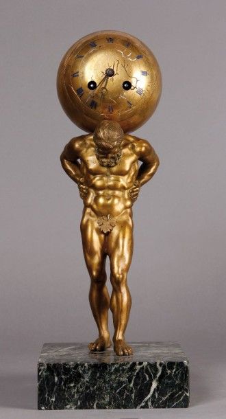 null Pendule en bronze ciselé et doré représentant le dieu Atlas supportant une sphère...