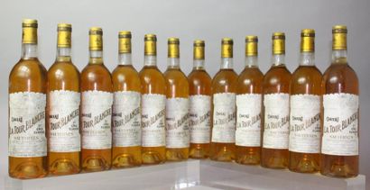 Douze bouteilles Château LA TOUR BLANCHE...