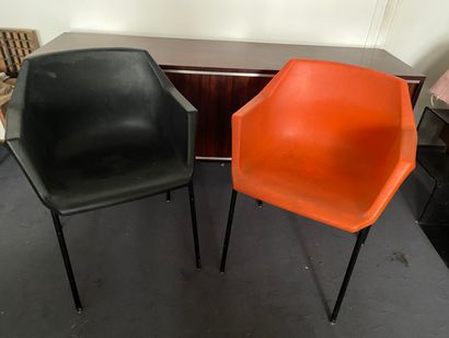 null Pair of stacking armchairs in colored resin, one orange and the other black,...