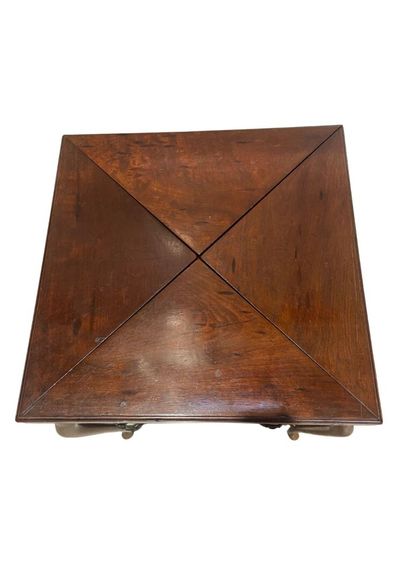 null Game table, mahogany and mahogany veneer, resting on 4 cambered legs joined...
