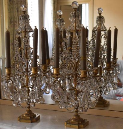 null PAIR OF GIRANDOLES with four lights in bronze, with pearl threads and pendants....