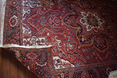 Oriental rug, red background with rosette...
