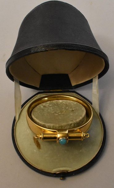 null Rigid gold BRACELET set with a turquoise cabochon and a motif containing a pencil....