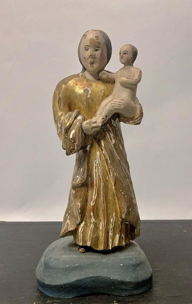 null Statuette d'une Vierge à l'Enfant polychrome et or. Fin XVIIIème siècle. 

Haut....