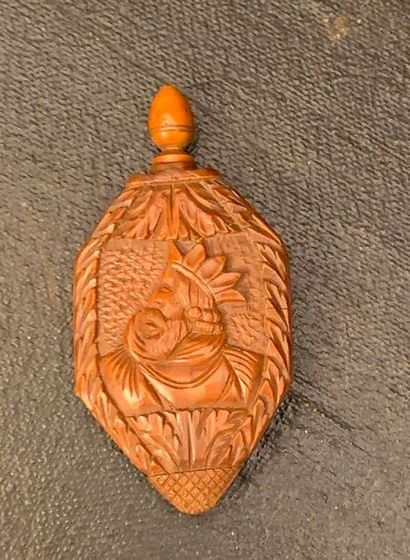 null Small corozo perfume bottle sculpted with a bust of a king and floral motifs....