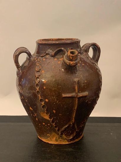 null Oil jug with two handles, pouring spout surrounded by a tie and decorated with...