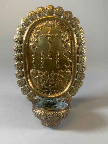 null Embossed brass stoup decorated with the monogram of Christ on the backsplash....