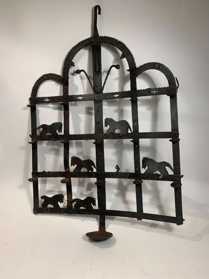 null Wrought iron wall lamp, forming an oil lamp equipped with eighteen cups with...