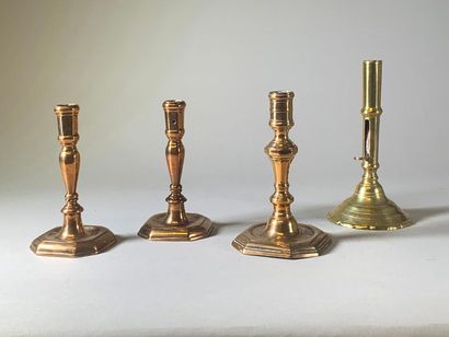 null Four brass candleholders, one pair of which is a pair. 18th and 19th century....