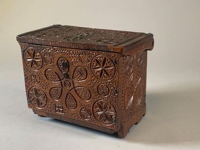 null Walnut box with a cockerel lock entrance decorated with rosettes and variously...