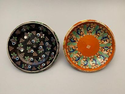 null Two glazed earthenware soup plates with polychrome floral decoration. Switzerland,...