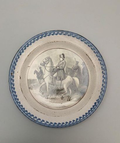 null Black dish decorated with Napoleon on horseback in grey monochrome. West of...