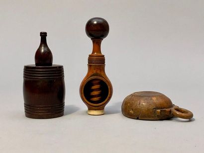 null Three pieces: a tobacco shaker showing a barrel topped by a bottle (cracks),...