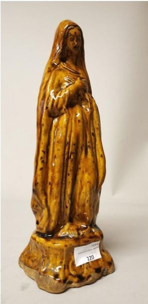 null Statuette of a Virgin in stoneware enamelled with honey-coloured slag. Laborne....