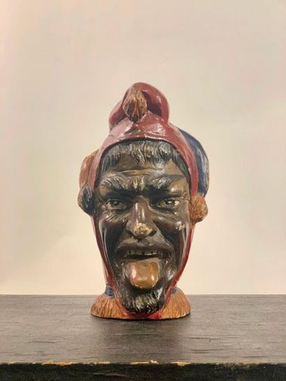 null Head representing a jester sticking out his tongue in polychrome wood. Italy....