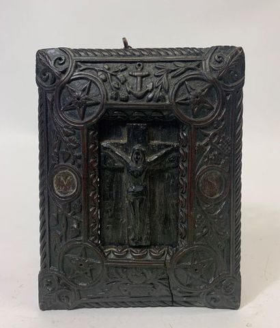null Wooden painting carved with a Christ on the cross in a frame adorned with stars,...