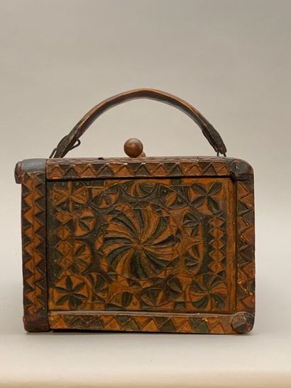 null Carved polychrome walnut basket with wickerwork bottom, with two flap lids and...
