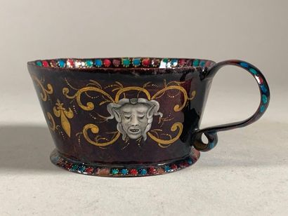 null Cup in polychrome enamel, Limoges style, decorated on the outside with masks...
